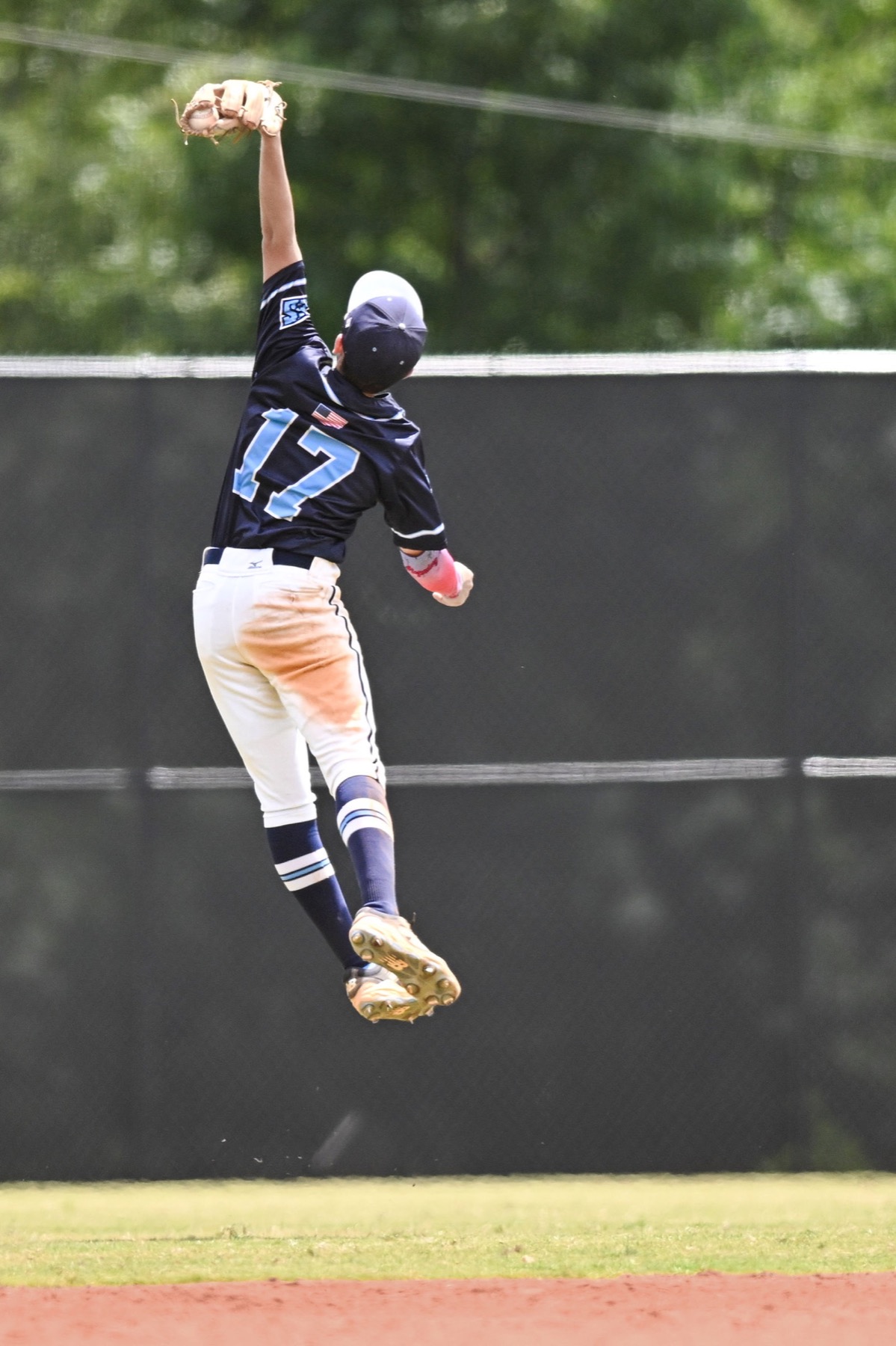 Baseball player leaping for a catch