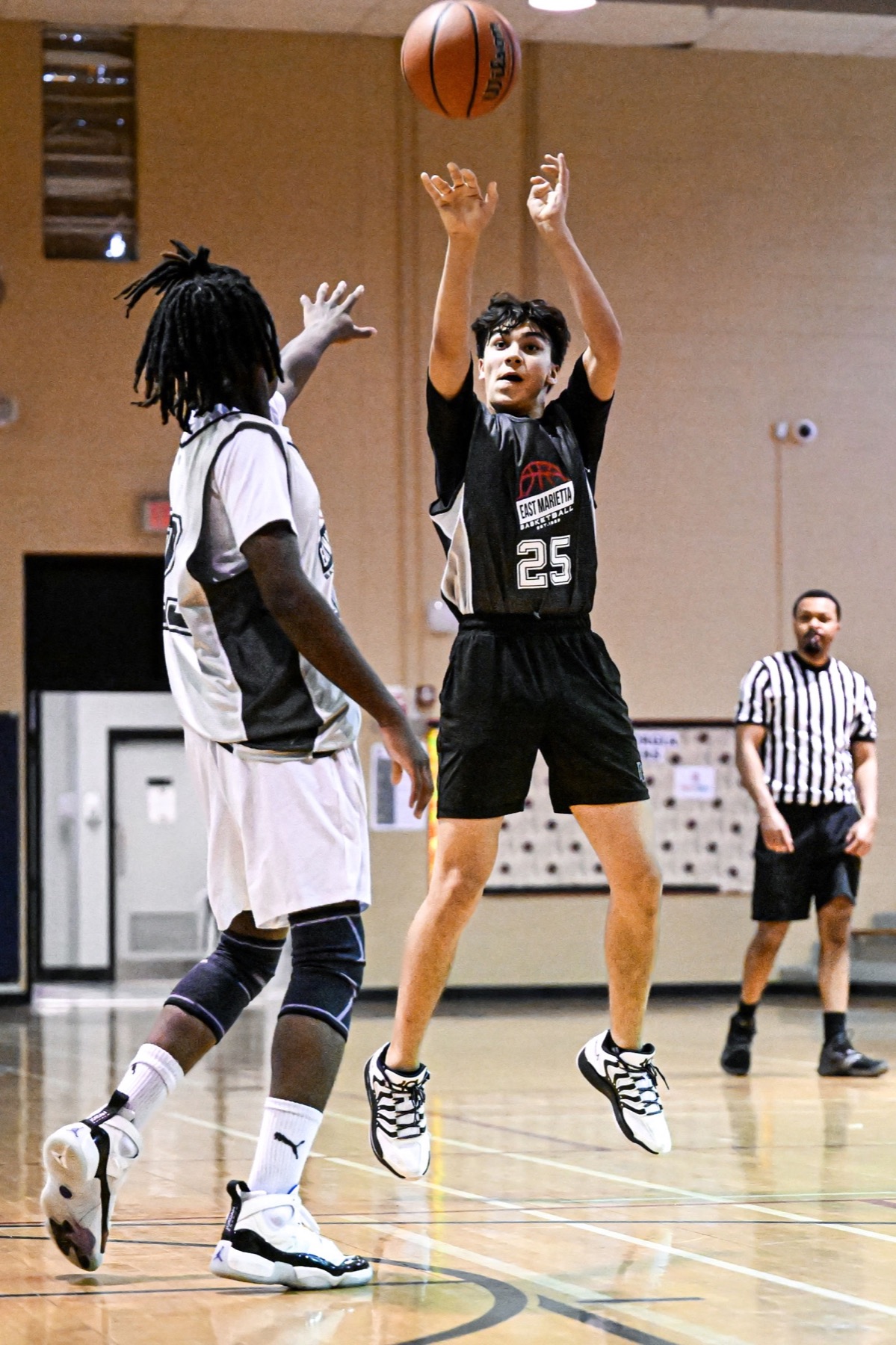 Basketball player taking a jump shot
