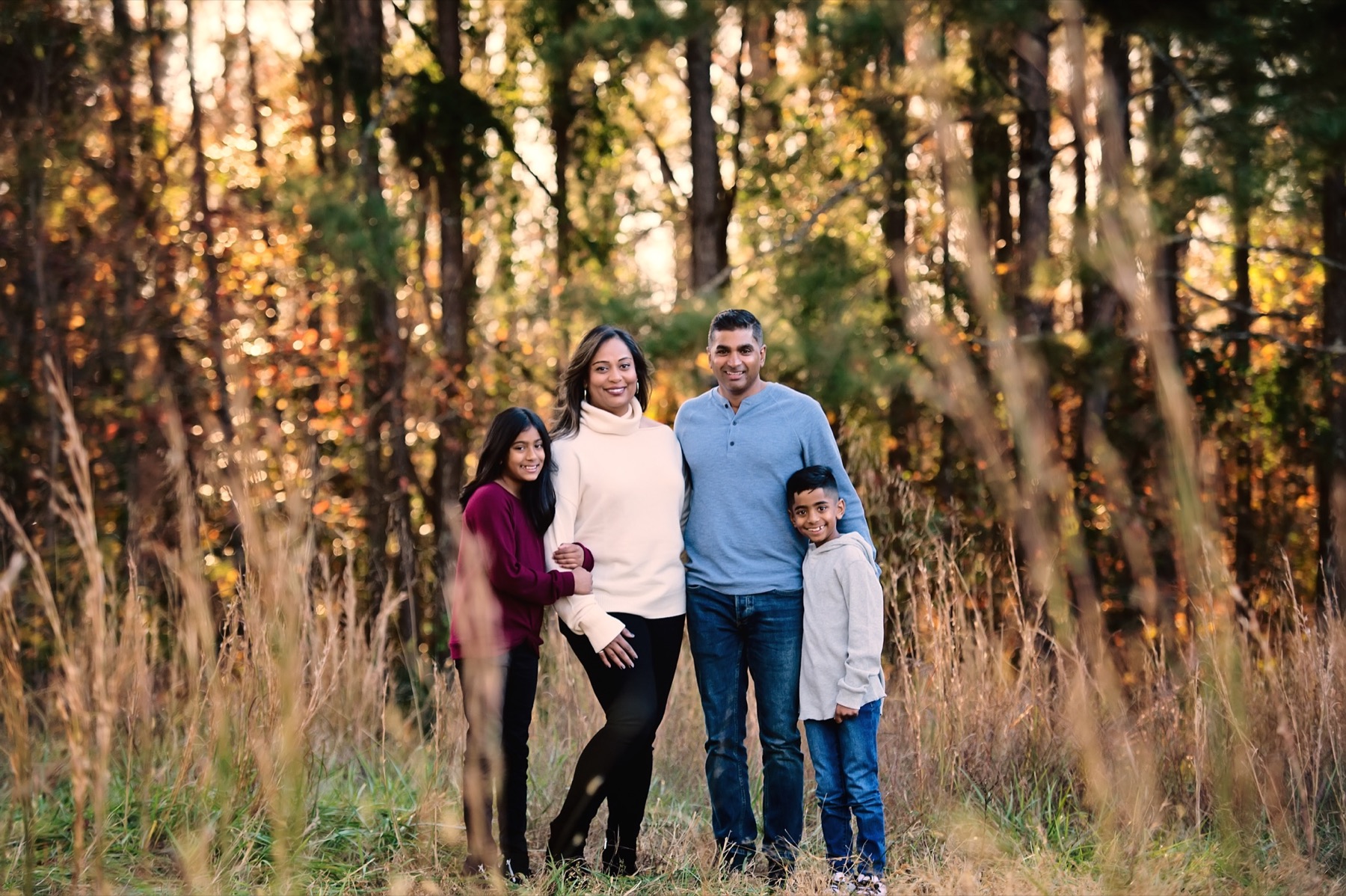Family portrait in a wooded field
