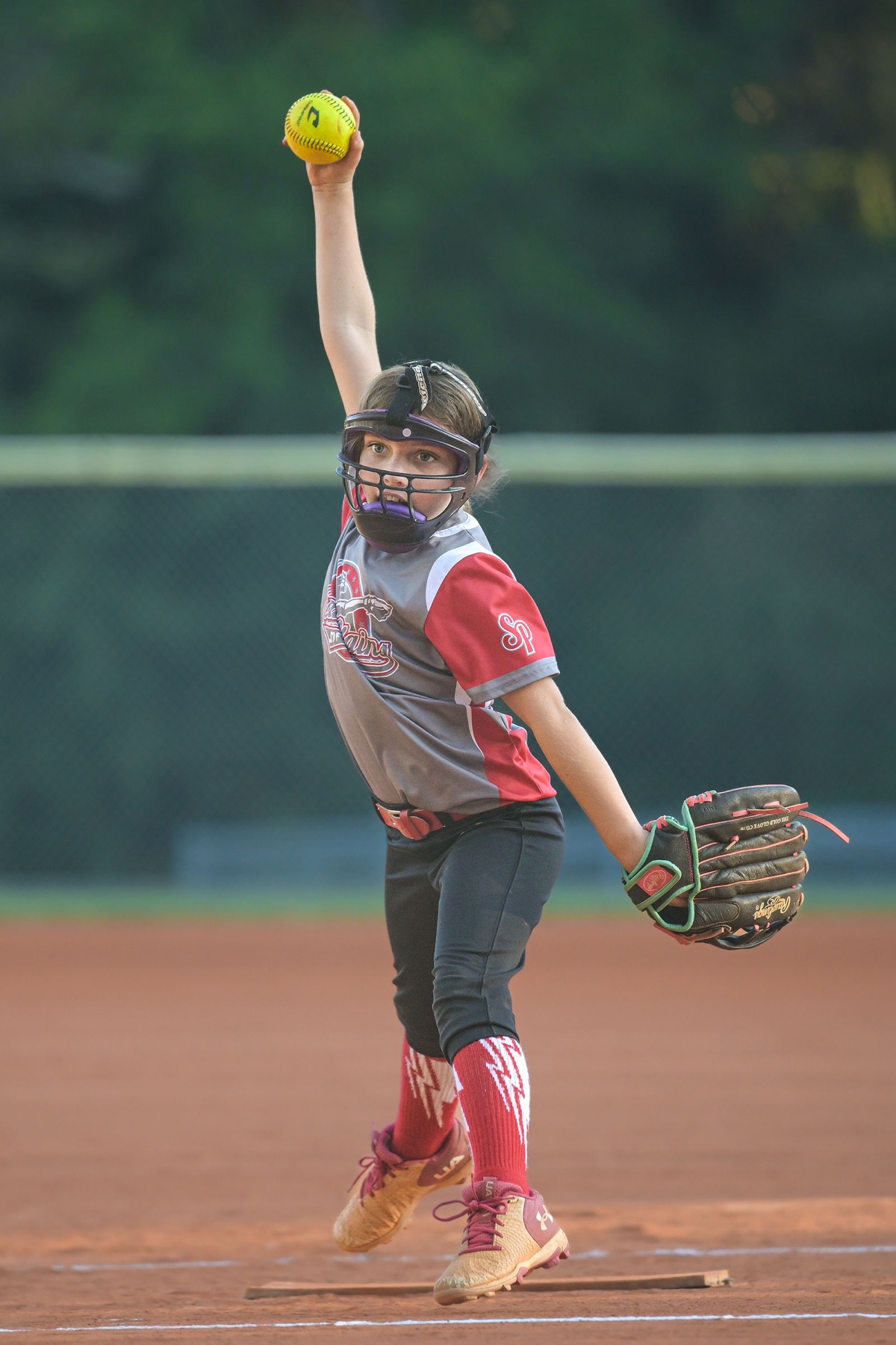 Softball pitcher beginning her delivery
